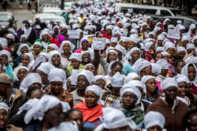 Kenyan women wearing white scarfs stage a multi-faith demonstration calling for peaceful election in downtown Nairobi on October 25, 2017.