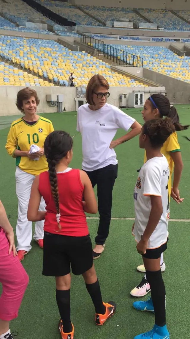 Adriana Behar of the Brazilian Olympic committee talks to the girls about mixed-gender games