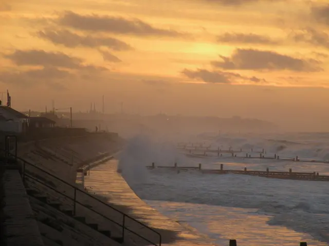 Walcott sea front, with Bacton gas terminal in the distance