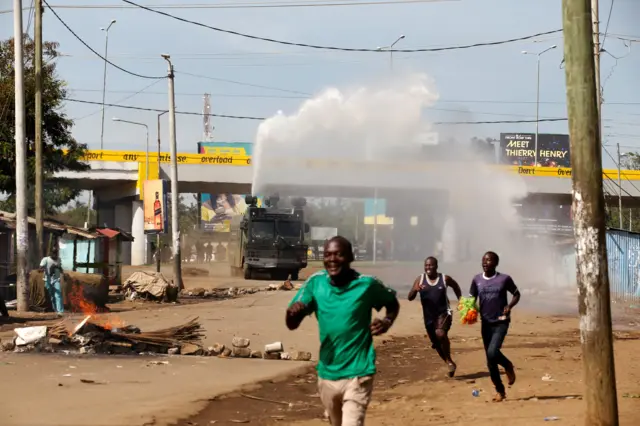 Kenyan anti-riot police deploy a water cannon during clashes with supporters of Kenyan opposition leader Raila Odinga, in Kisumu, Kenya, October 26, 2017.