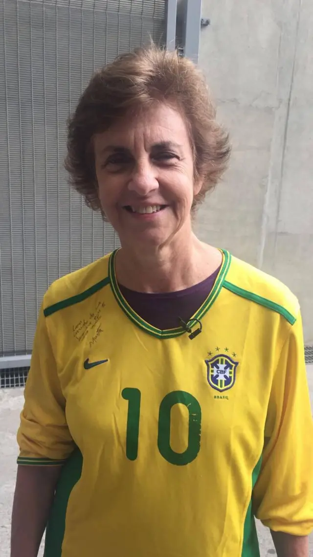 Helena Pacheco wears a Brazil football shirt which is signed by Marta