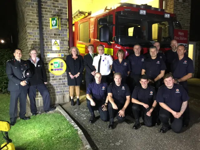 Firefighters and family members at the unveiling of the newly named fire engine