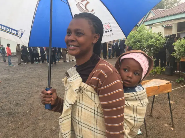 Mother and baby at a polling station in Nairobi, Kenya