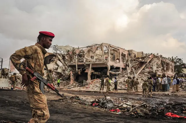 This file photo taken on October 15, 2017 shows Somali soldiers patroling on the scene of the explosion of a truck bomb in the centre of Mogadishu. Somalia"s deadliest ever attack, a truck bomb in the capital Mogadishu.