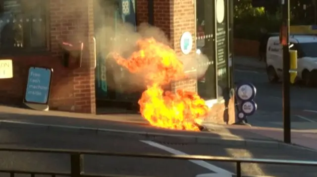 Electrical fire bursts out of manhole