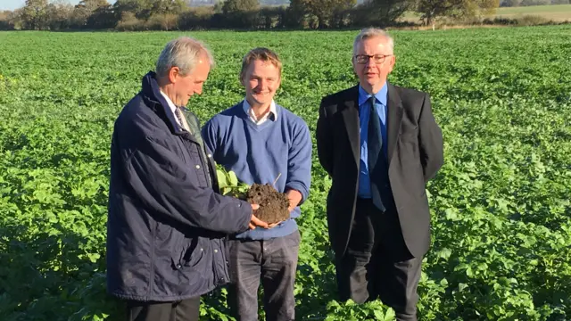 Michael Gove in a field