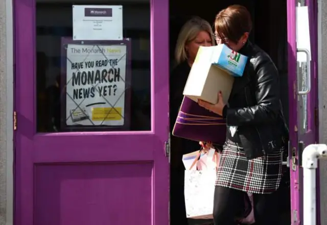 Monarch employee leaving premises