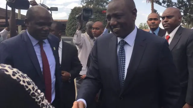 William Ruto shaking hands