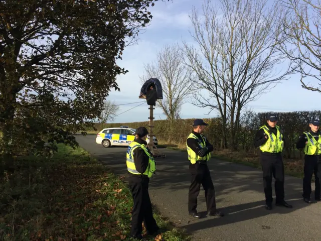 Wood structures block Habton Road near Kirby Misperton