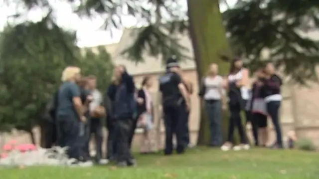 Police officer speaking to youngsters