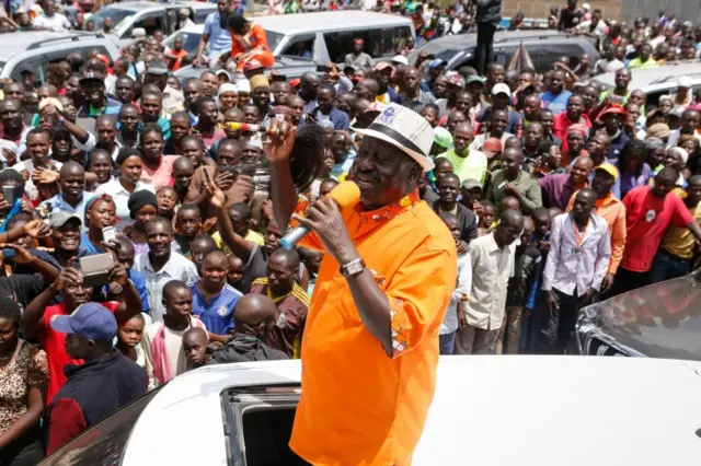 Raila Odinga (C) addresses thousands of his supporters as he drives through Kawangware slum after attending a church service in Nairobi, Kenya, 29 October 2017