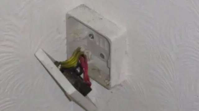 Exposed electrical wires in a Jersey rental property