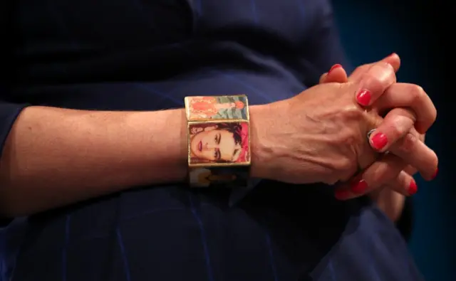 sporting a bracelet featuring images of the Mexican painter Frida Kahlo