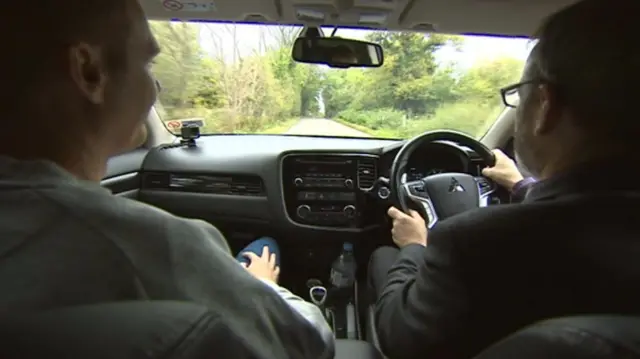 Peter Plisner driving a car