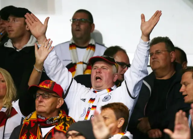 A German fan celebrating at Windsor Park