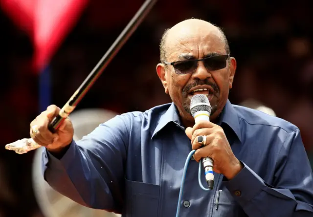 Sudanese President Omar al-Bashir delivers a speech during a visit to the village of Bilel in South Darfur, near the Kalma camp for displaced people, on September 22, 2017