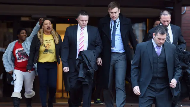 PCs Mark Fannon (third from left), Paul Adey (foreground) and Paul Greenfield (right) pictured at a hearing in November