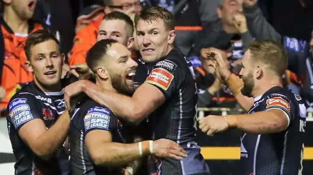 Luke Gale celebrates with his team-mates after the St Helens win