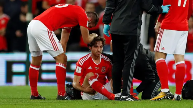 Joe Allen receives medical attention