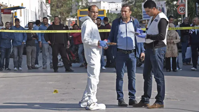 Forensic officers outside the parliament in Tunis, Tunisia