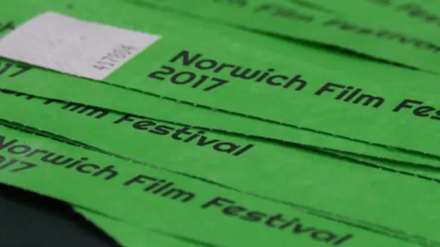 Green coloured tickets for the Norwich film festival