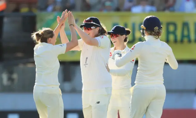 Laura Marsh (left) celebrates a wicket