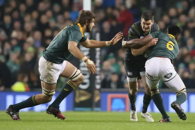 Ireland's Johnny Sexton in action with South Africa's Siya Kolisi