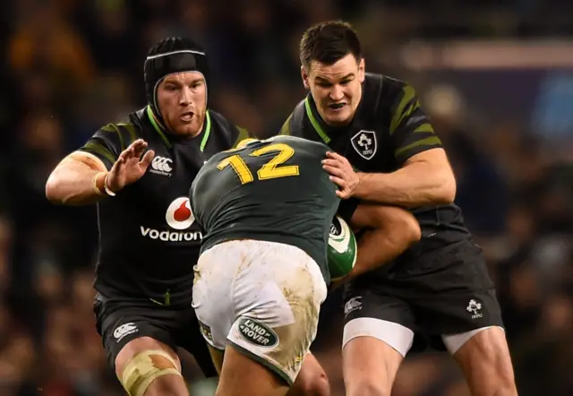 South Africa's Damian de Allende tackled by Ireland's Johnny Sexton