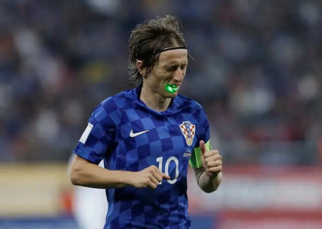 Croatia's Luka Modric has a laser shone at him