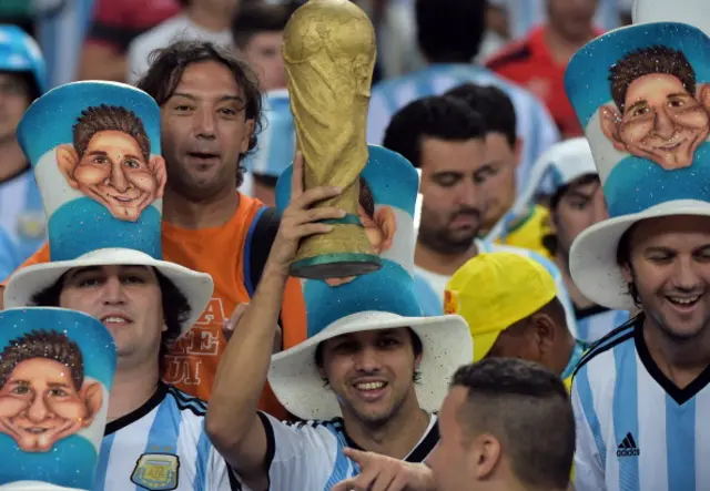 Argentina fans with a world cup mock up trophy