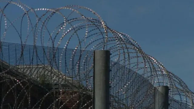 Wire atop prison fencing