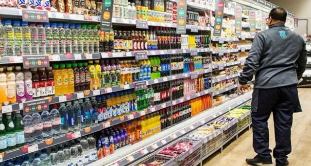 Worker in a co-op shop