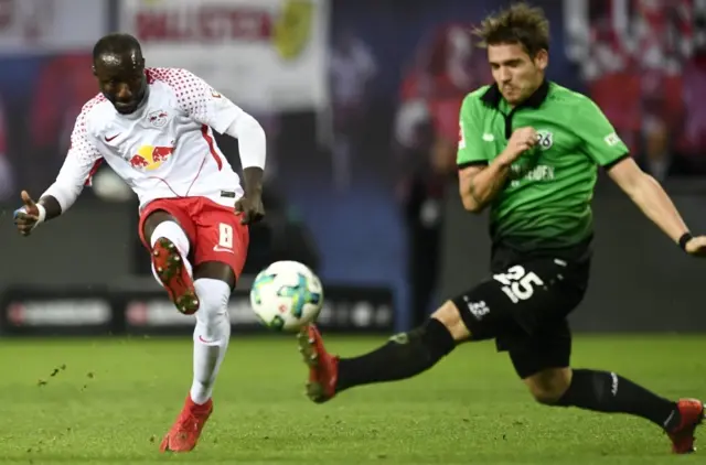 Naby Keita (L) in action against Hannover's Oliver Sorg during the German Bundesliga soccer match between RB Leipzig and Hannover 96 in Leipzig,