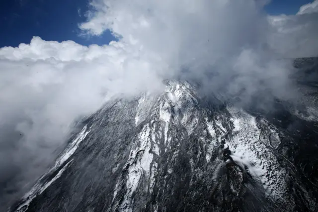 Volcano under cloud