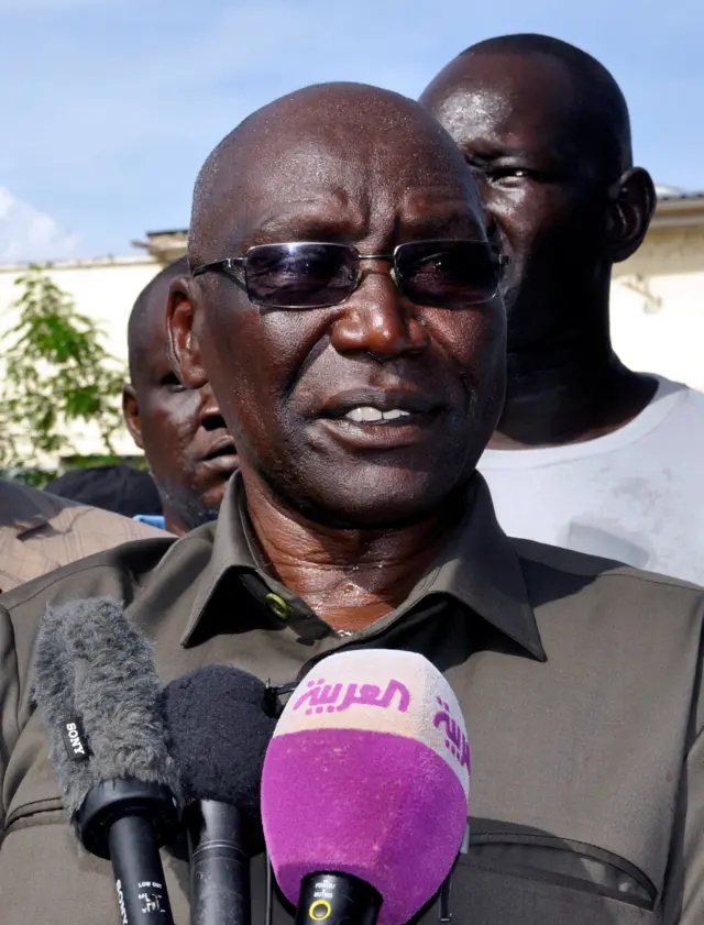 Paul Malong speaks into reporters' microphone at a press conference after his sacking in May 2017