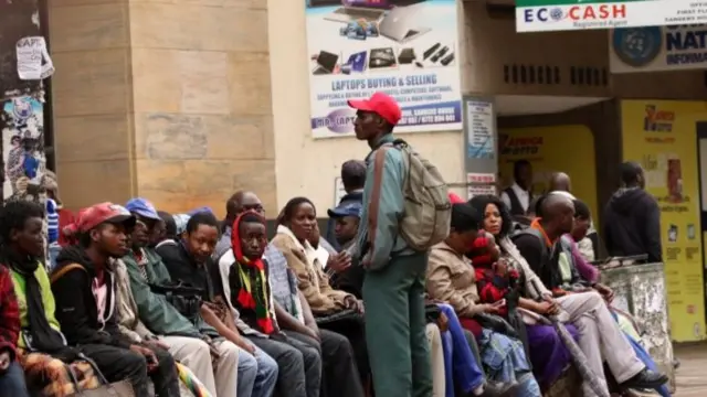 People queuing outside a bank in Harare, Zimbabwe