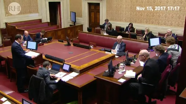 Wide shot of the inquiry in session