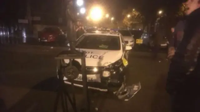 Police car and statue