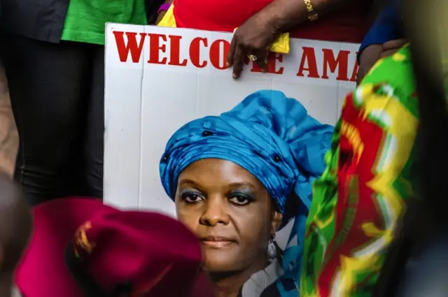 A woman holds a portrait of Grace Mugabe during a gathering of President"s supporters at his party headquarters to show support to Grace Mugabe becoming the party"s next Vice President after the dismissal of Emerson Mnangagwa November 8 2017