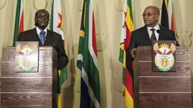 Zimbabwe's President Robert Mugabe (left) and South Africa's President Jacob Zuma deliver a speechin 2015