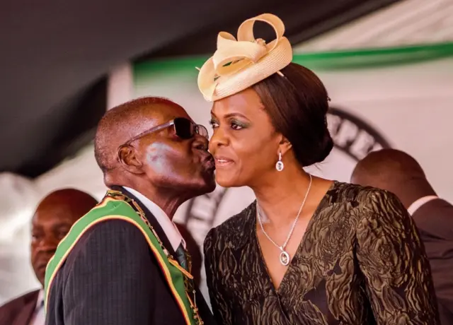 President Robert Mugabe kissing his wife and first lady Grace Mugabe during during the country"s 37th Independence Day celebrations at the National Sports Stadium in Harare