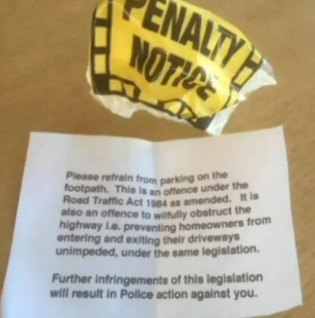 A plastic penalty notice envelope and letter.