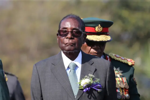 Zimbabwean President Robert Mugabe inspects a guard of honour before officially opening the 107th edition of the Harare Agricultural Show in Harare, Zimbabwe, August 2017