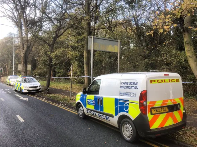 Police vans outside the cemetery in Hull.