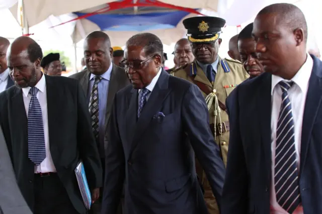 Robert Mugabe (C) makes his first public appearance four days after the Zimbabwe National Army (ZNA) took over control of government in Harare, Zimbabwe, 17 November 2017