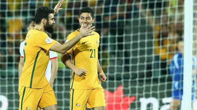 Mile Jedinak of Australia congratulates team mate Massimo Luongo