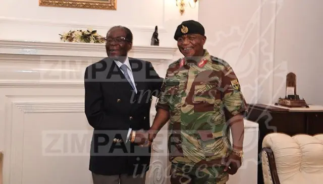 Mugabe poses with General Constantino Chiwenga at State House in Harare, Zimbabwe, November 16, 2017.