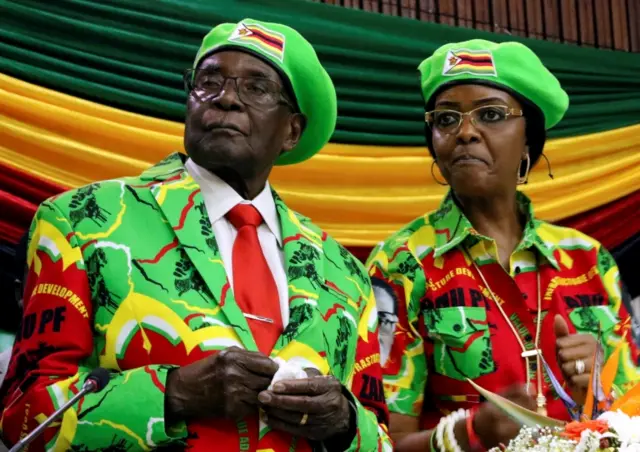 Zimbabwean President Robert Mugabe and his wife Grace attend a meeting of his ruling ZANU PF party"s youth league in Harare, Zimbabwe, October 7, 2017.