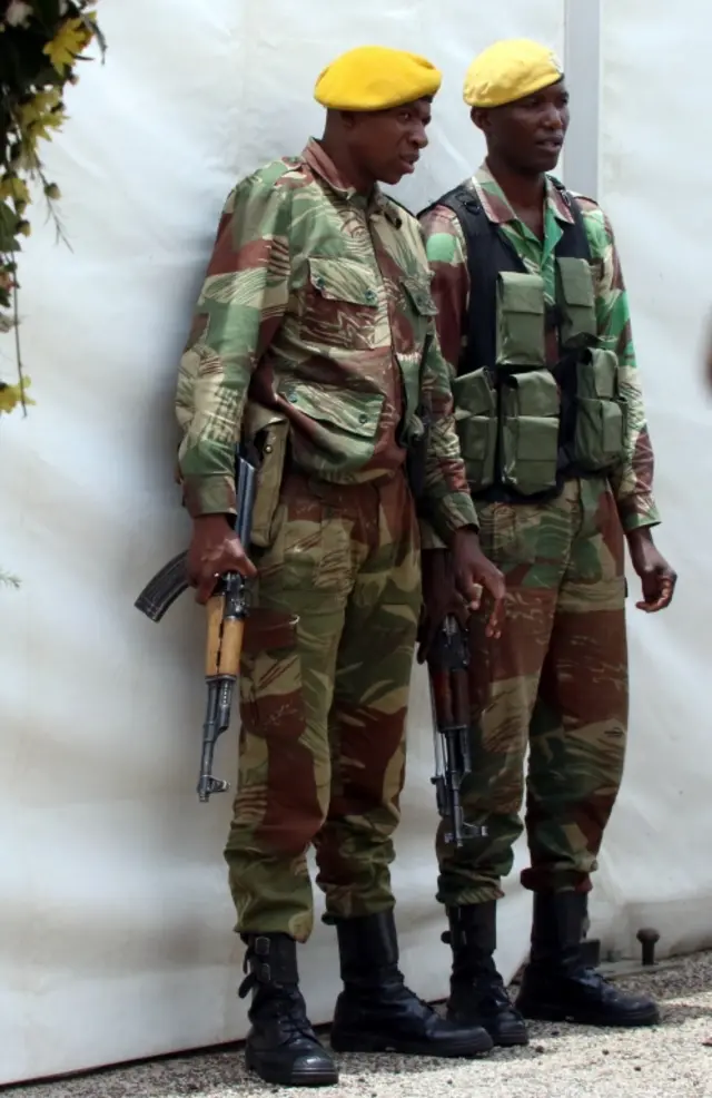 Soldiers stand guard as President Robert Mugabe attends a university graduation ceremony in Harare, Zimbabwe, November 17, 2017.