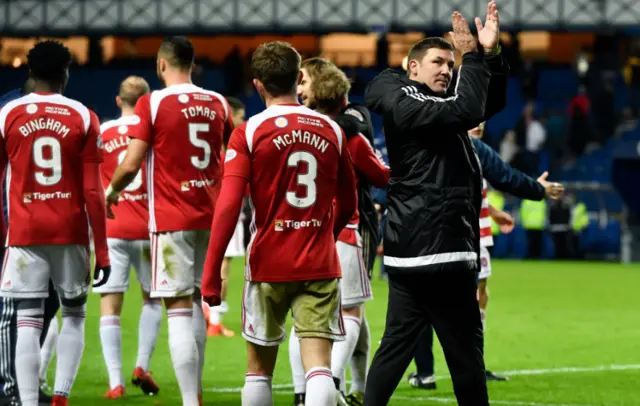 Accies manager Martin Canning applauds the visiting fans at Ibrox